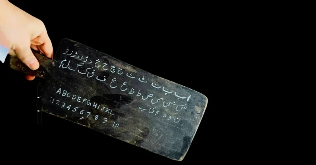 Traditional Urdu takhti used for practicing Urdu alphabet and handwriting.